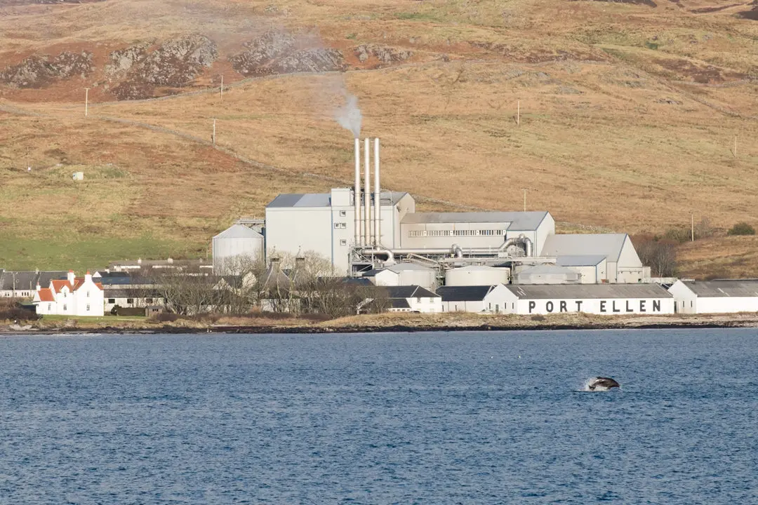 Port Ellen Distillery and jumping dolphin, Isle of Islay
