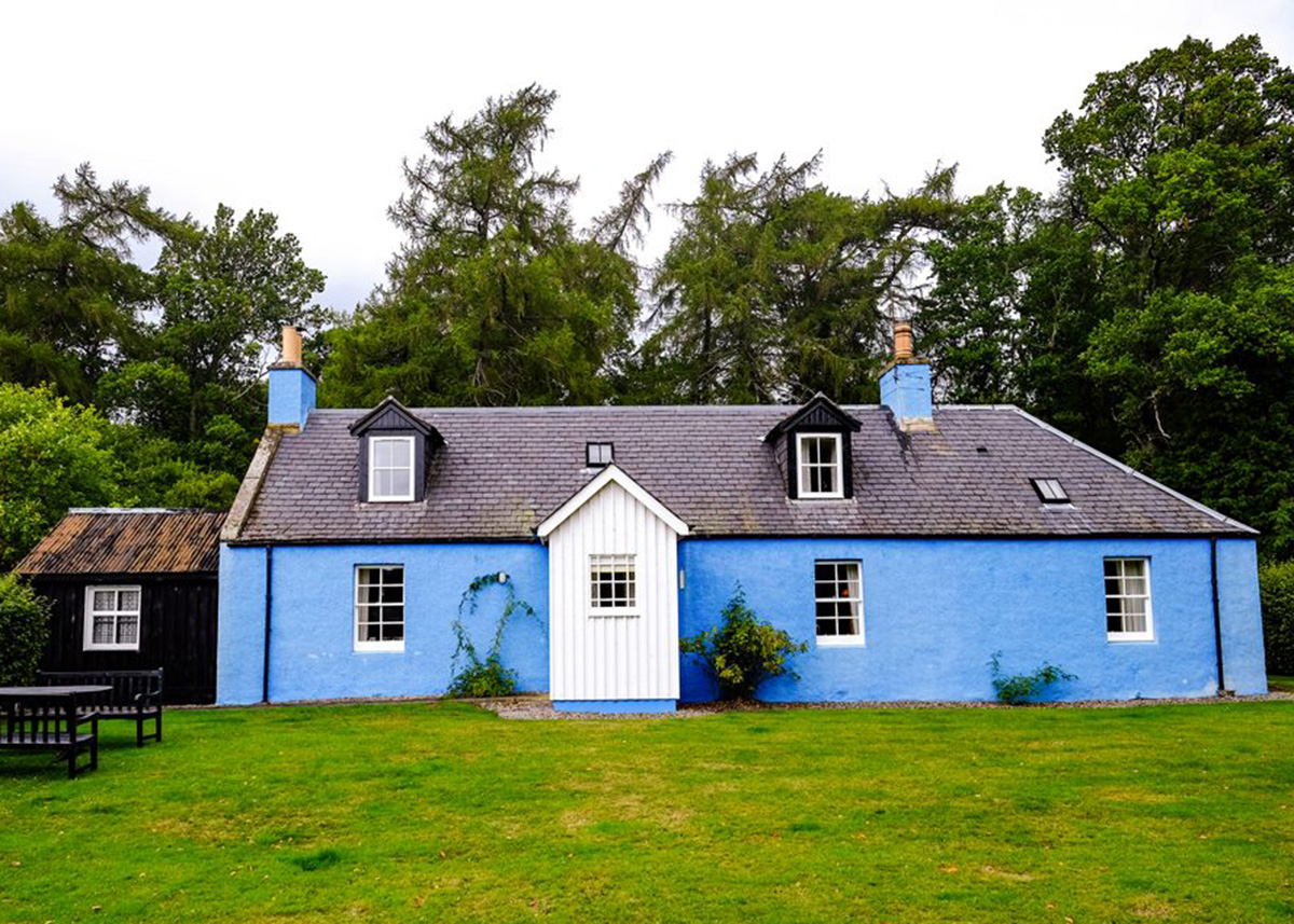 Lochanshelloch Cottage on the Cawdor Estate surrounded by woodland in the Scottish Highlands