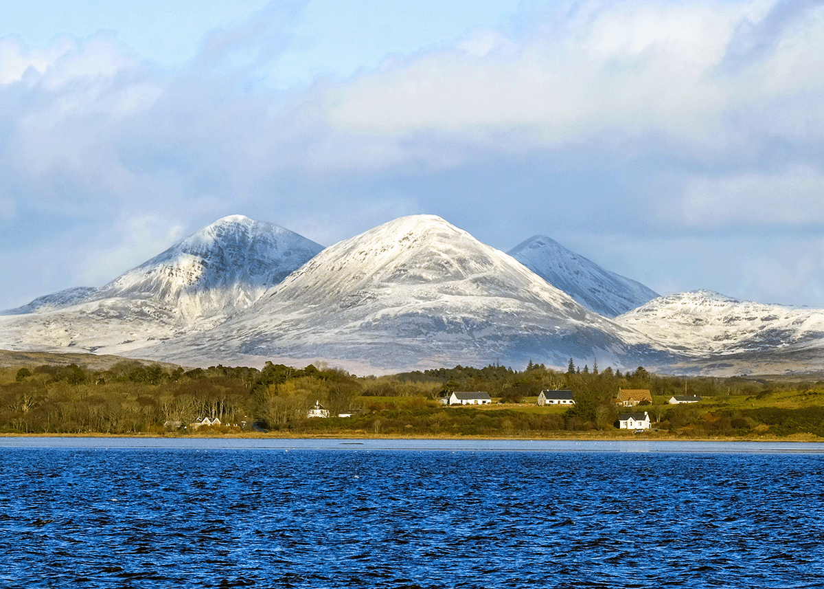 Snow covered Paps of Jura from Islay