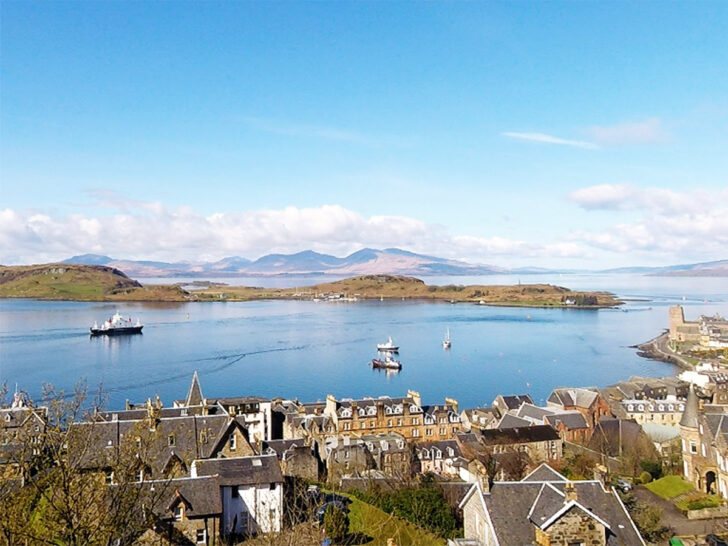 Oban harbour waterfront with fishing boats and views across the bay in Argyll
