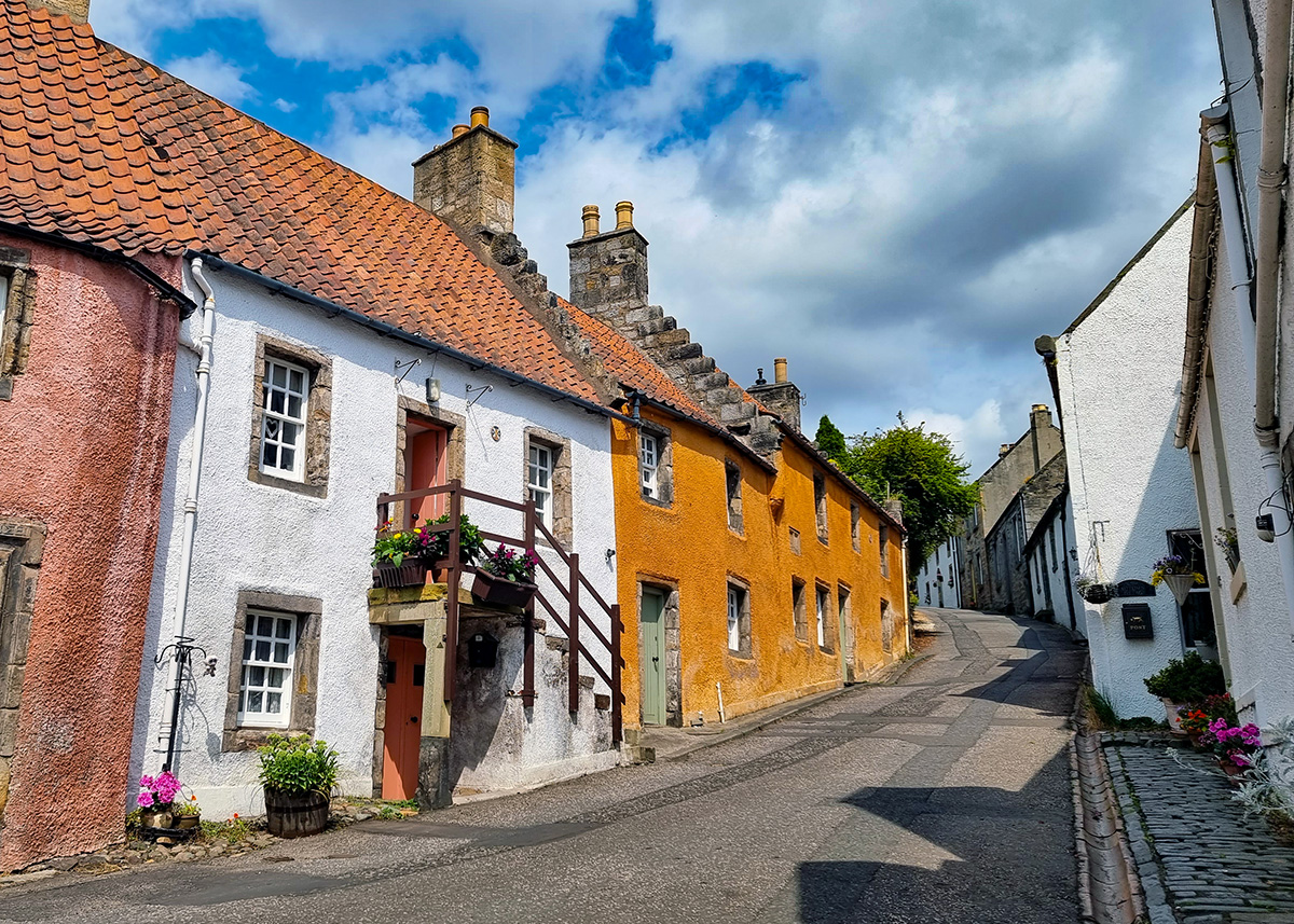 Charming colourful cottages on cobbled street in Culross on the Firth of Forth.