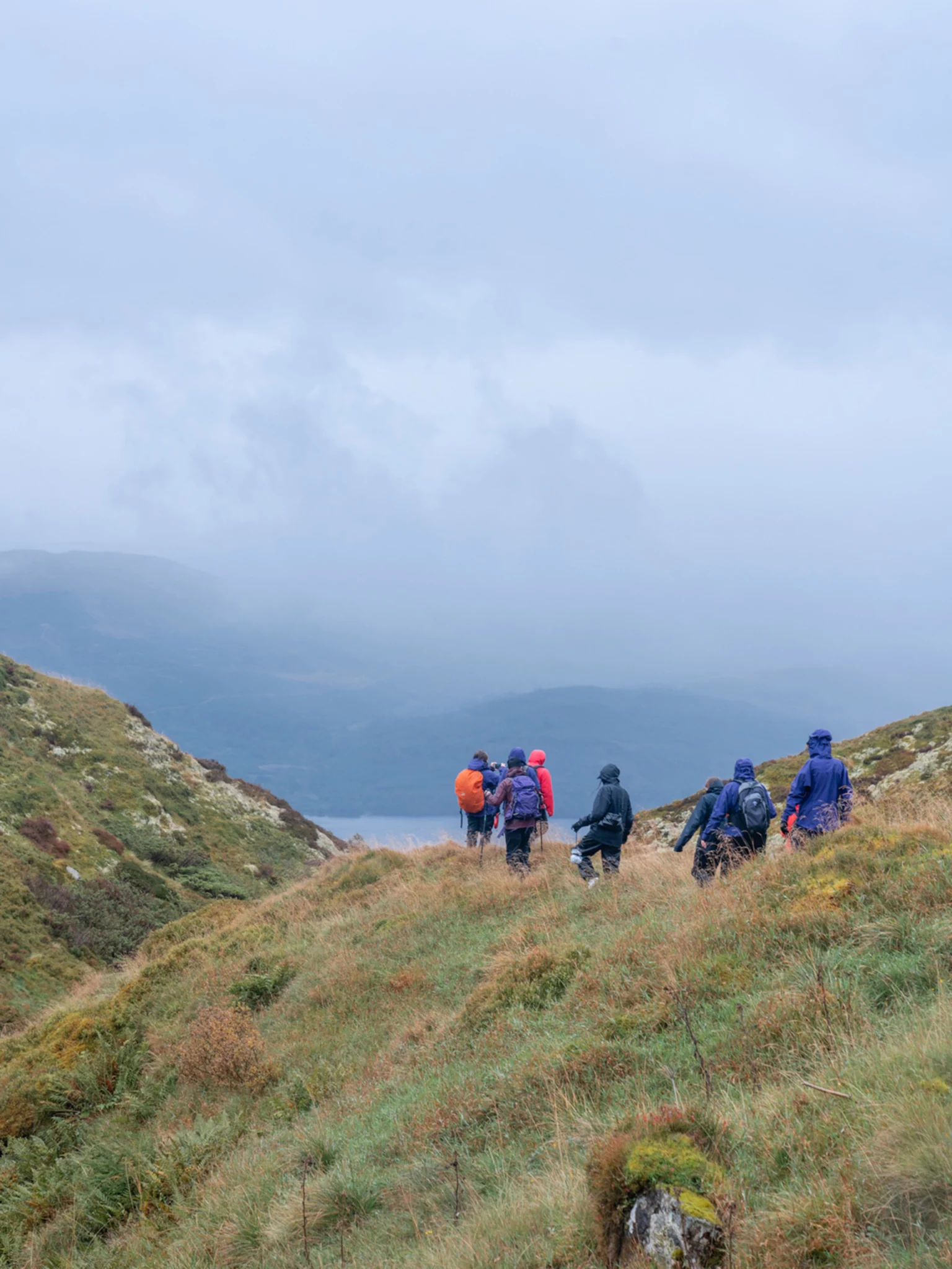 Hikers walking down towards Loch Tay